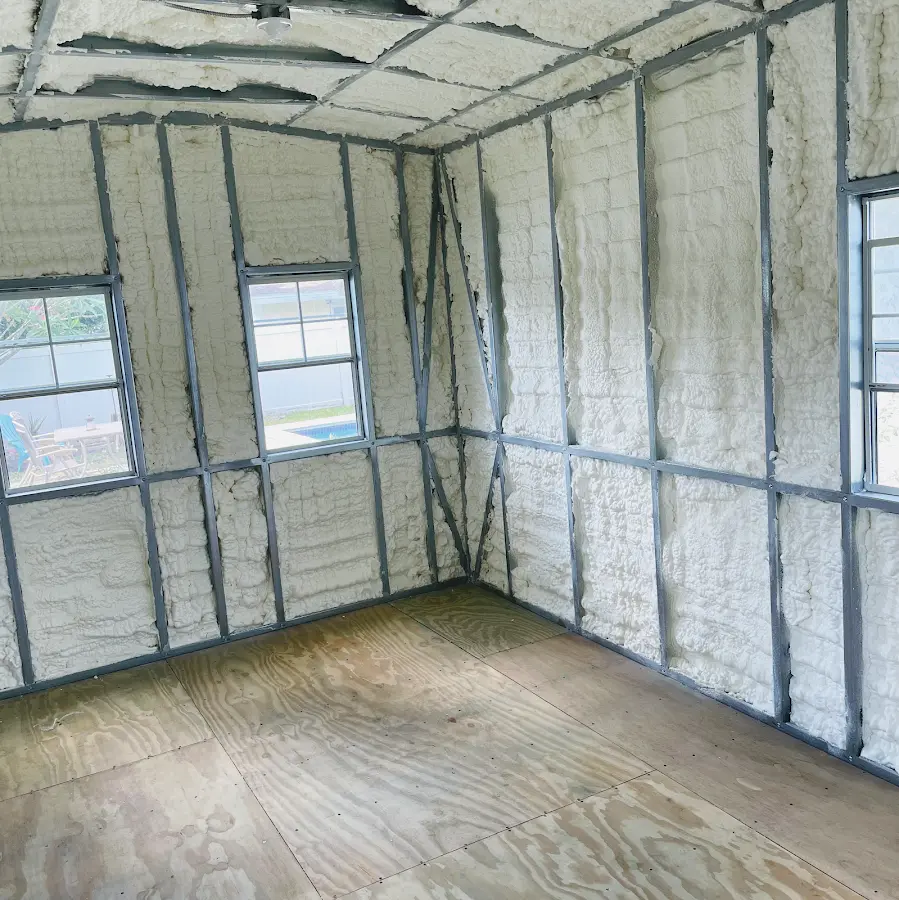 Closed-cell spray foam insulation applied to wall cavities in a residential project in Brockton
